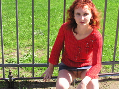 My nasty redhead exgirlgriend poses nude for my camera on the streets exposing her shaved pussy and small tits. Image 1