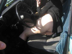 See my wife's bare photos posing in the open air sitting on my car and on the meadow. Image 3