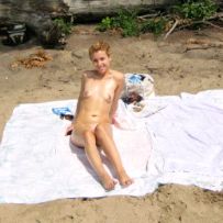 Posing naked on the beach