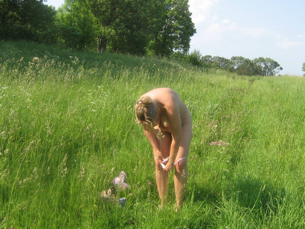 See my exwifes nude pics posing outdoors on the meadow and sitting image photo